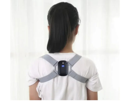 Woman wearing a gray electronic posture corrector with a digital display on her back