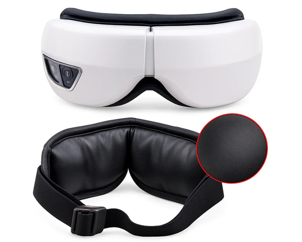White electric eye massager with black adjustable strap and soft leather cushion close-up